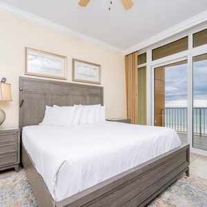 Retreat to the king master suite with cozy bedding and drift off to the sound of the waves from the balcony