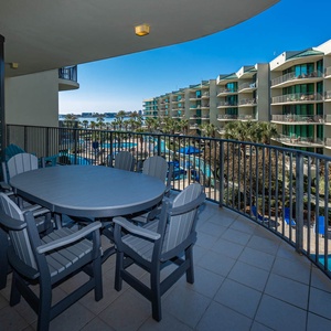 Savor the coastal breeze on your balcony, embracing moments of connection in the sun