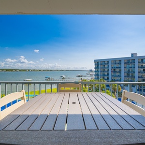 Savor morning coffee at your balcony table while enjoying tranquil lagoon views and refreshing coastal breezes
