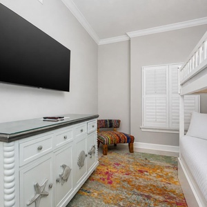 Stream your favorite show in the guest bunk room with a cozy twin over double bunk