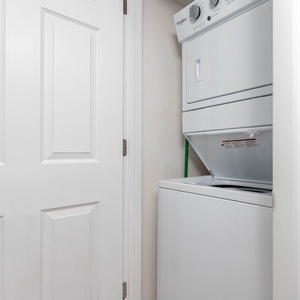 Washer and dryer conveniently located in a compact laundry nook, providing easy access for guests during their stay