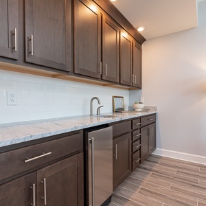 Grab a chilled drink from the built-in mini fridge or pour your favorite drink from the wet bar