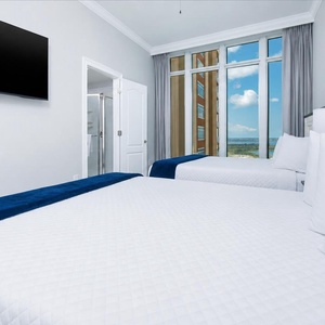 Rest on the queen beds, gaze past the windows at coastal views, and relax with your favorite show
