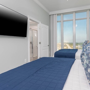 Part the curtains, recline on the fluffy queen beds in this guest suite, and watch the coastline