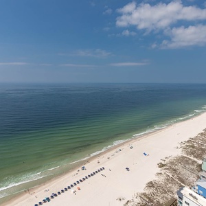 Experience seemingly endless coastline views of the horizon as waves lap the shore and the sun glistens over the water