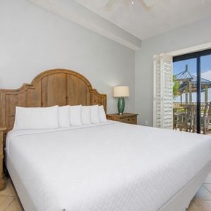 Retreat to the king master suite, enjoying views of your patio where the coastal vibe beckons you to relax