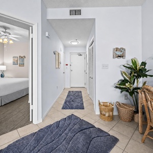 Step into your inviting entryway, where cheerful decor and a cozy workspace beckon you to unwind before exploring the coast