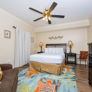 Relax in this vibrant queen guest suite with additional twin chair sleeper and coastal accents