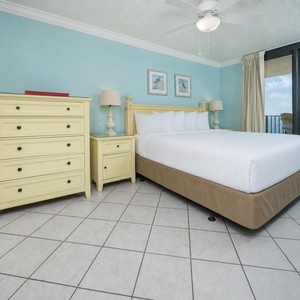 Unwind in the serene bedroom featuring a comfortable bed, charming decor, and sliding doors to the outdoor space