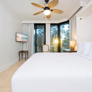 Experience peaceful mornings in this guest suite, enjoying gentle breezes and sunshine streaming from the balcony