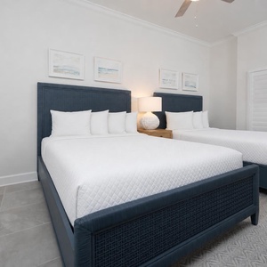 Relax on one of the cozy queen beds in this guest suite and enjoy a peaceful slumber