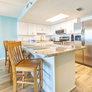 Sit at the breakfast bar and enjoy lively conversation while meals cook in the bright kitchen