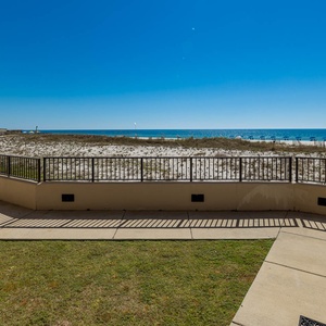 Step outside to enjoy the fresh air and views of the tranquil waters and sand dunes just beyond the patio