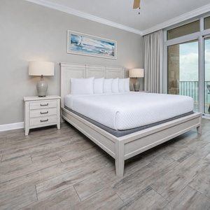 Retreat to the king master suite with cozy bedding and drift off to the sound of the waves from the balcony