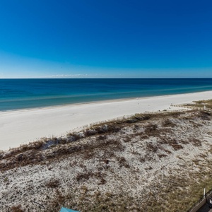 Serene waters and expansive shoreline, perfect for relaxing and enjoying the coastal atmosphere