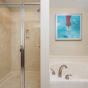 Elegant master bathroom, featuring a walk-in shower and a soothing jetted tub for your comfort