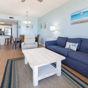 Relax in the spacious living area with a comfortable sofa with queen sleeper, coffee table, and inviting décor