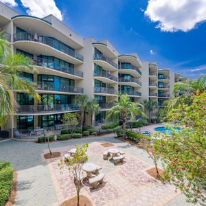 Discover the refreshing pool area with an inviting lazy river and thrilling waterslide