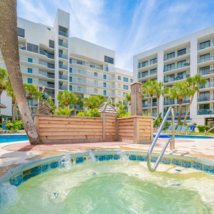 Unwind and relax in the soothing hot tub after a fun-filled day at the beach