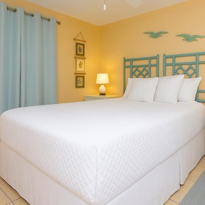 Drift into restful sleep in this queen guest suite while beach decor enhances your serene retreat