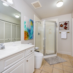 Refresh in this additional guest bath with a walk-in shower and laundry area with a washer and dryer in your rental