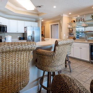 Sip your morning coffee at the breakfast bar and get ready for a beach day in this stylish space