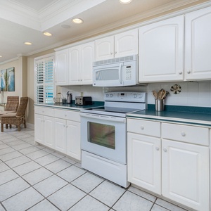 Cook and enjoy meals with a beachfront view, featuring ample counter space and an open design