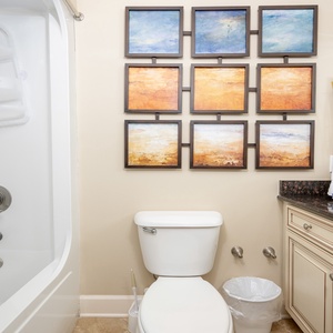 Rejuvenate in this relaxing guest bath, enjoying plush towels and serene decor after your beach adventures