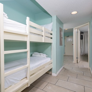 Bunk beds for children adorn the hallway, providing additional sleeping arrangements for the family