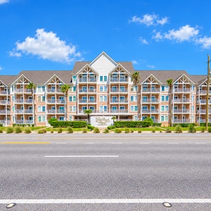 Welcome to The Grand Beach Resort, featuring beautiful landscaping and easy access to stunning beach views