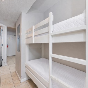 Bunk beds in the hallway offer a cozy spot for the kids after fun-filled days along the coast