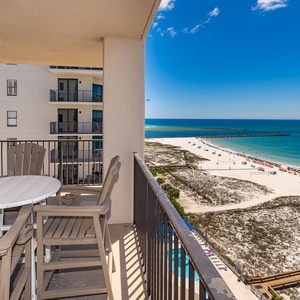 Pull up a chair on your balcony to savor a quiet moment watching waves gently lap the shore below