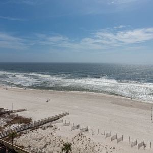 Breathe in the fresh coastal breeze on your balcony while gazing at the tranquil waves crashing along the shore