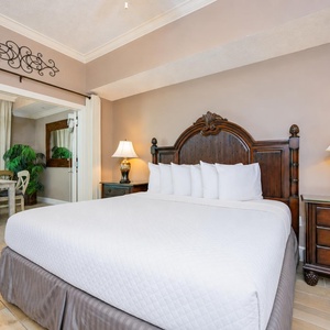 Embrace relaxation in the plush king bed, with gentle lighting and coastal decor setting a serene vibe in the master