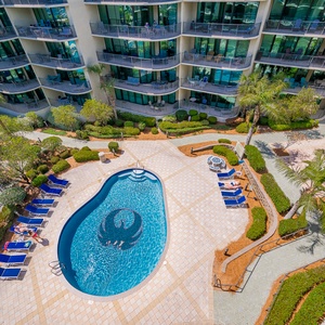 Bask by the poolside, soaking in the warmth of the sun as you enjoy refreshing drinks and the company of friends