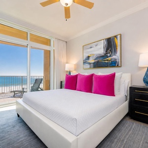Retreat to this elegant king master suite with cozy bedding and drift off to the sound of the waves from the balcony