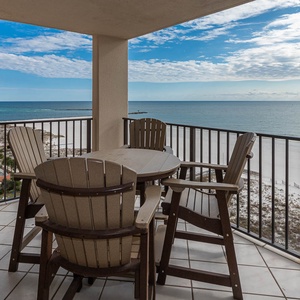 Savor your morning coffee at the outdoor table, enjoying sweeping views of the tranquil waters and shoreline