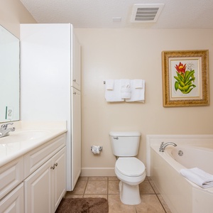 Refresh in the master bath after a day of adventure with a soothing jetted tub and relaxing walk-in shower