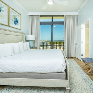 Unwind in this king guest suite, where soft bedding invites relaxation and views of the coast inspire calm moments
