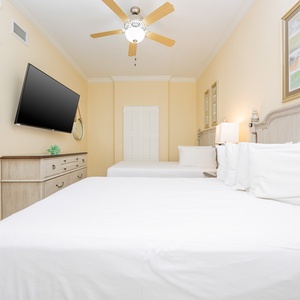 Relax on a cozy queen bed in this guest suite and stream your favorite shows after a beach day