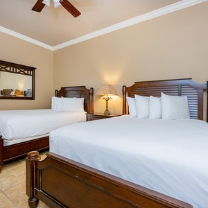 Rest easily in the queen beds, as soft light bathes this cozy guest room, creating a welcoming retreat