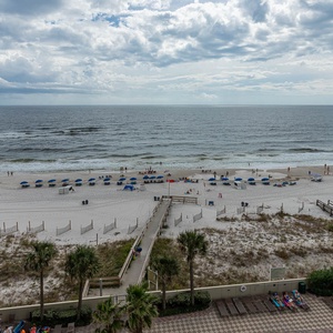 Experience the refreshing coast breeze from your balcony while taking in the expansive beach views and vibrant activity