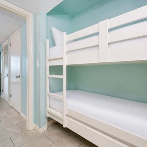 Bunk beds in the sleeping area offer a cozy spot for the kids after fun-filled days along the coast