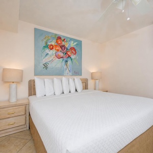 Crisp linens and gentle lamp light welcome you to rest peacefully in the king suite