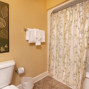 Experience refreshing moments in the guest bathroom, wrapped in soft towels after a rejuvenating shower