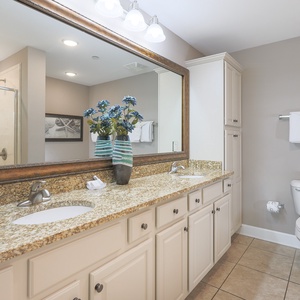 Refresh in the master bath after a day at the beach with a soothing jetted tub and relaxing walk-in shower