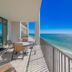 Enjoy impressive views from the spacious balcony, complete with a table and chairs for relaxing moments by the sea