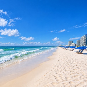 Enjoy a day on the soft, white sand with beach chairs and umbrellas, just steps from the tranquil waters and stunning views