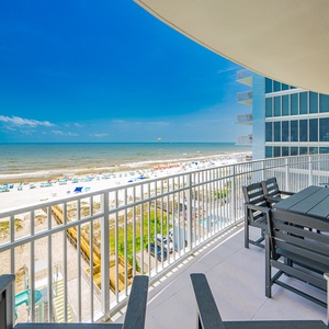 Take in the refreshing breeze, overlooking the beach and vibrant beachgoers below