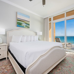 Retreat to the king master suite with cozy bedding and drift off to the sound of the waves from the balcony